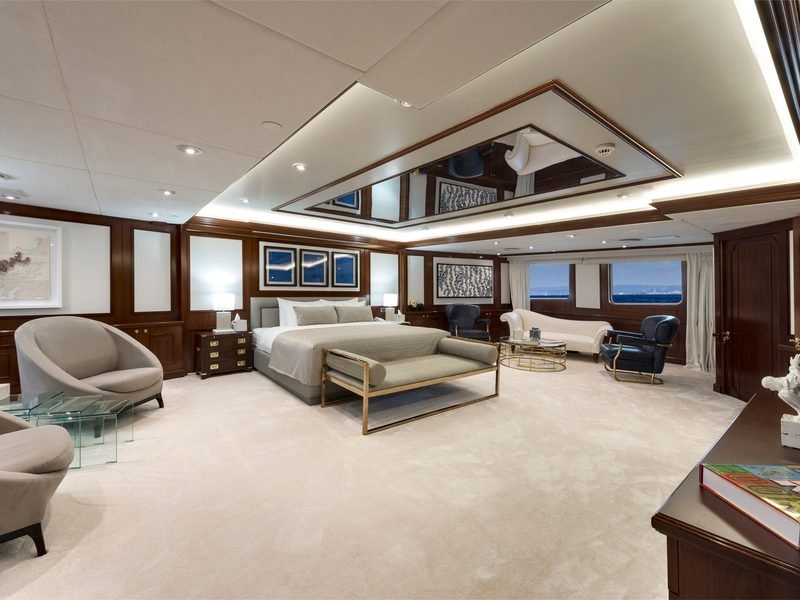 Master suite panelled in mahogany, king berth, private seating and windows onto the sea